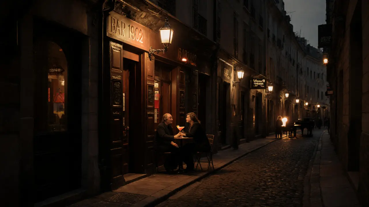 Intimate bar on Rue Princesse lit by lanterns, patrons enjoying cocktails in the dark.