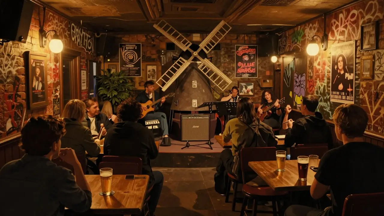 Intimate live music scene inside The Windmill pub, band playing to a small, diverse crowd.